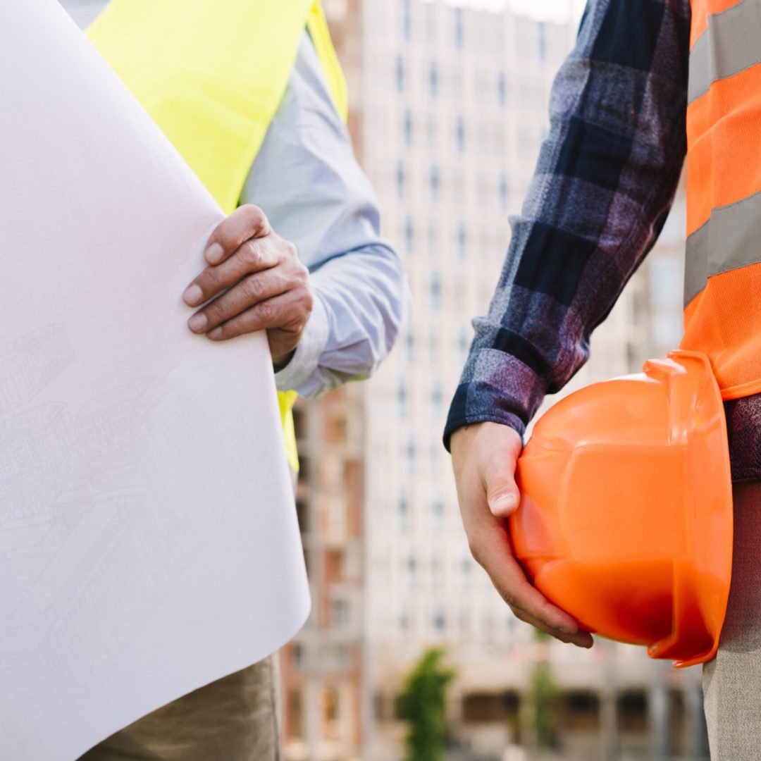 close-up-men-with-safety-vests-helmet